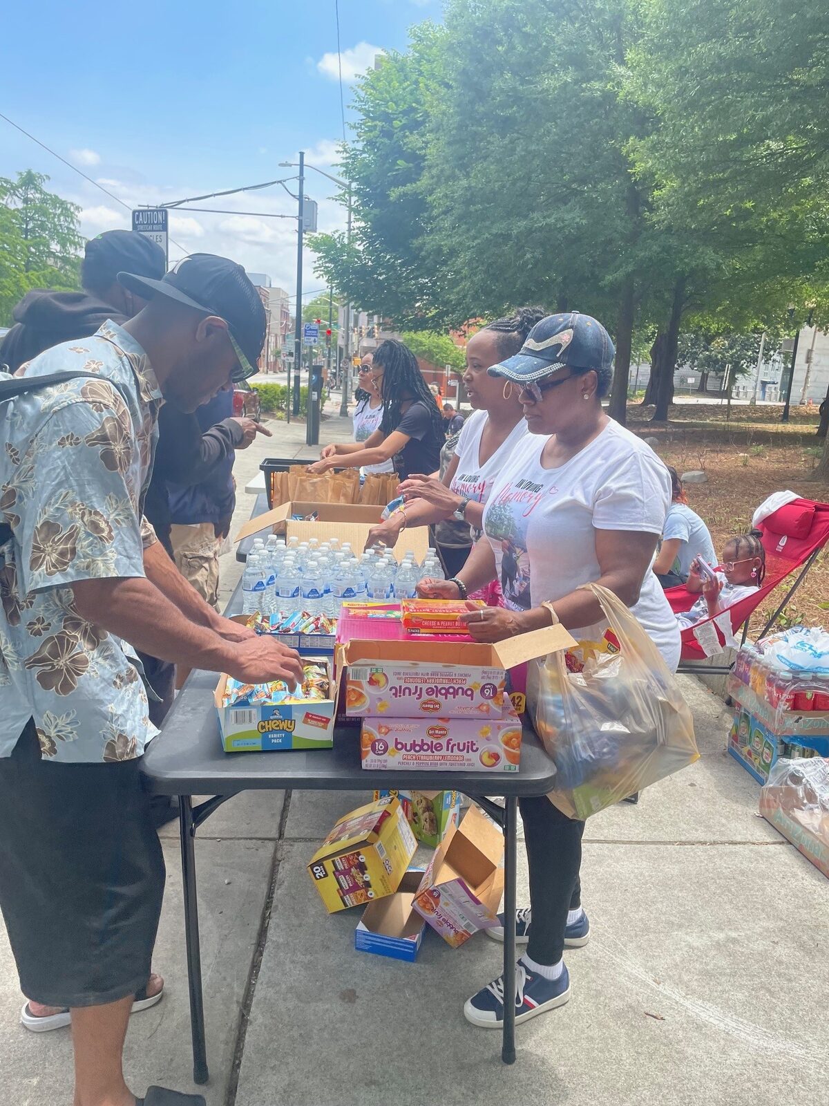 Volunteers distributing snacks and drinks